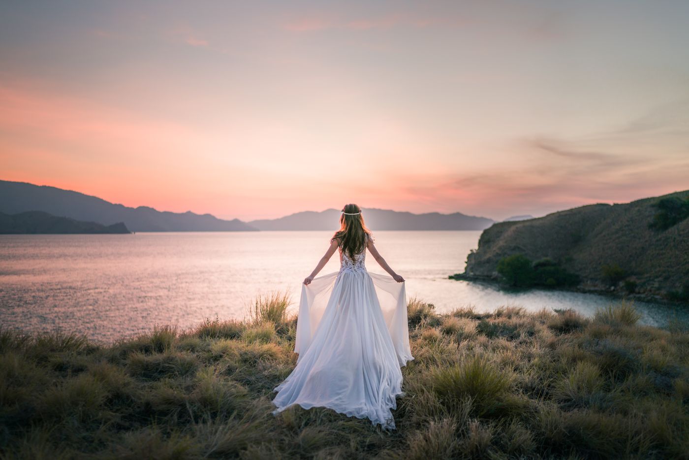 Couple on a Bali clifftop at golden hour